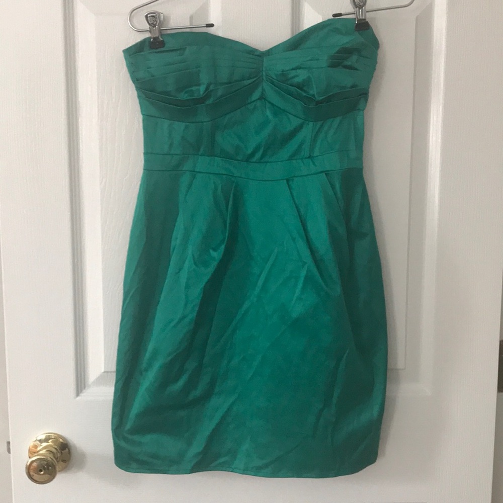 Form-fitting green dress